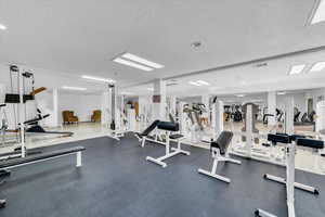 Workout area featuring a textured ceiling