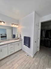 Bathroom featuring vanity and a textured ceiling