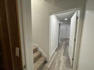 Hall featuring light hardwood / wood-style flooring