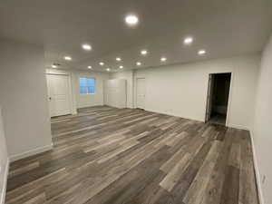 Basement featuring dark hardwood / wood-style flooring