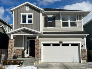 View of front facade featuring a garage