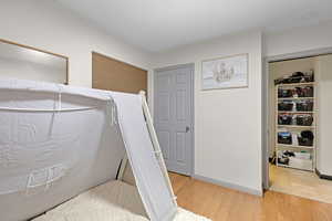 Bedroom featuring a closet and hardwood / wood-style flooring