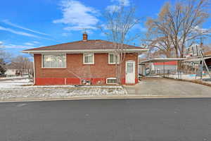 View of front of house with a carport