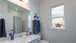 Bathroom with vanity, a mountain view, toilet, and walk in shower