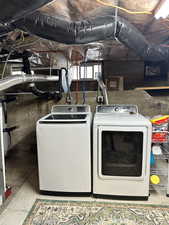 Washroom featuring washer and dryer