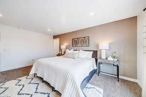 Bedroom with light colored carpet