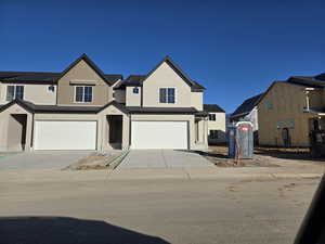 View of front of home featuring a garage