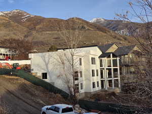 View of property exterior with a mountain view