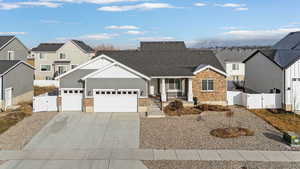 View of front of house with a garage and covered porch