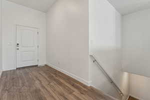 Foyer entrance featuring hardwood / wood-style floors