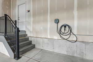 Stairway featuring concrete flooring