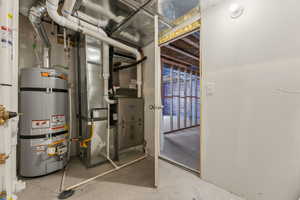 Utility room with strapped water heater