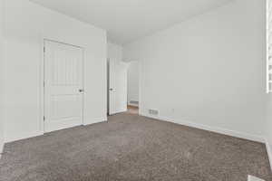 Unfurnished bedroom featuring carpet flooring