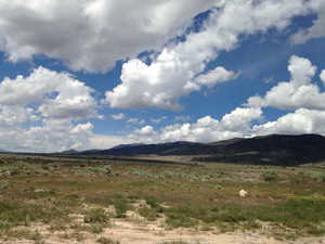 Property view of mountains with a rural view