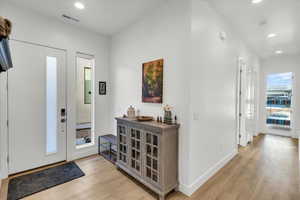 Entryway with light wood-type flooring