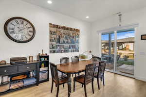 Dining room with light hardwood / wood-style floors