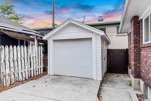 View of garage at dusk