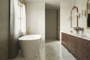 Bathroom with vanity, a tub to relax in, and a wealth of natural light