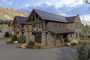 View of front of home featuring a balcony