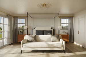 Bedroom featuring light hardwood / wood-style floors, crown molding, and multiple windows