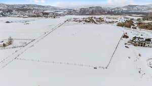 Snowy aerial view featuring a mountain view