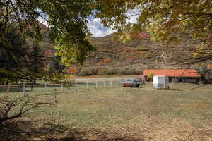 View of yard featuring a rural view and a mountain view