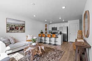 Living room featuring a textured ceiling and dark hardwood / wood-style flooring