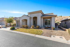 View of front of property featuring a garage