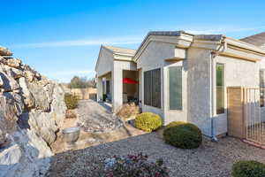 View of side of home featuring a patio