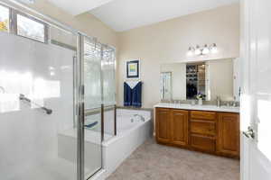 Bathroom featuring independent shower and bath, tile patterned flooring, and vanity