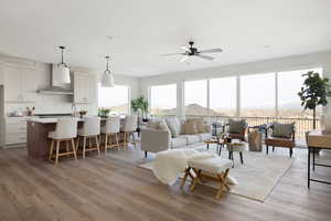 Living room featuring ceiling fan and dark wood-type flooring