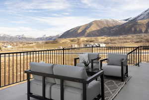 View of patio / terrace with a balcony and a mountain view