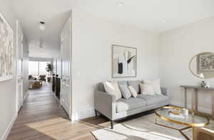 Living room with light wood-type flooring