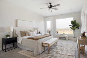 Carpeted bedroom featuring ceiling fan