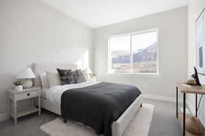 Bedroom featuring light colored carpet and a mountain view