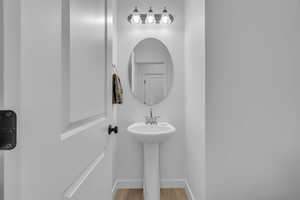 Bathroom featuring hardwood / wood-style flooring and sink