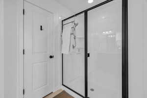 Bathroom with a shower with shower door