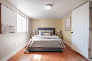 Bedroom with hardwood / wood-style floors