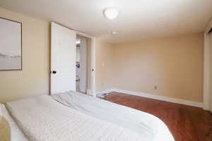 Bedroom featuring dark wood-type flooring