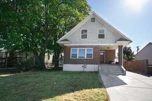 View of front of property featuring a front lawn