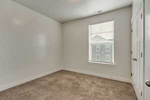 Empty room featuring carpet