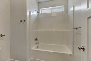 Bathroom with shower / tub combination