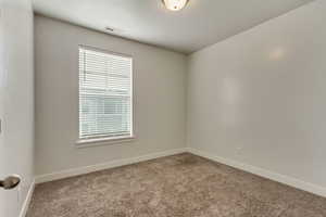 Unfurnished room featuring carpet floors