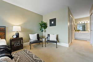 Sitting room with light colored carpet