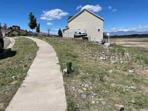 View of side of property with a mountain view