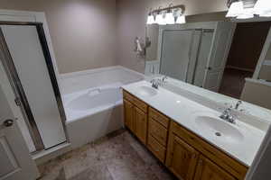 Bathroom with independent shower and bath and vanity