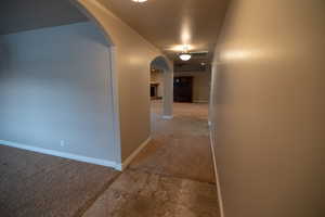 Hallway with carpet flooring