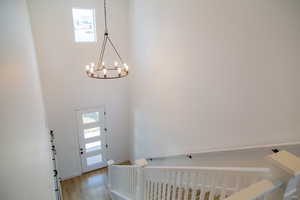 2 Story entry with chandelier & wood banister