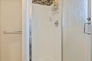 Bathroom with a shower with door