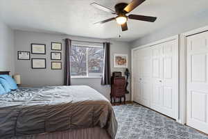 Bedroom featuring a textured ceiling and ceiling fan